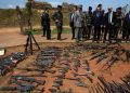 epa04104025 French President Francois Hollande (3-L), French Defense Minister Jean-Yves Le Drian (3-R) and French Foreign Minister Laurent Fabius (L) inspect arms confiscated from ex-Seleka rebels and Anti-balaka militia by the French military of operation Sangaris at a French military base in Bangui in Bangui, Central African Republic, 28 February 2014.  EPA/SIA KAMBOU/POOL MAXPPP OUT