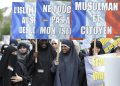 French muslim people hold banners reading 'do not touch my Islam' (C) and 'muslim and citizen' (R) during a demonstration in Paris, France on 02 April 2011, against islamophobia. ANSA/EMMA FOSTER