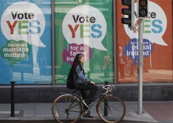 YES posters cover a shop's windows in the center of Dublin, Ireland, Thursday May 21, 2015.  People from across the Republic of Ireland will vote Friday in a referendum on the legalization of gay marriage, a vote that pits the power of the Catholic Church against the secular-minded Irish government of Enda Kenny.  (AP Photo/Peter Morrison)