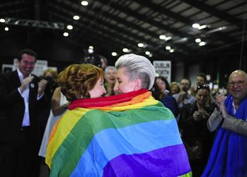 epa04763150 Monnine Griffith (L) and Clodagh Robinson celebrate after early results suggest an overwhelming majority in favour of the referendum on same-sex marriage, at the Dublin City Count Centre, Ireland, 23 May 2015. With counting still taking place in the historic referendum, early results are suggesting the Yes side has won, and opponents of the measure have already offered congratulations. It's the first time there has been a nationwide vote on the issue of same-sex marriage anywhere in the world.  EPA/AIDAN CRAWLEY