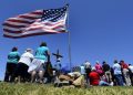 epa03230706 People attend a prayer service at the location of a local church that was destroyed by an F5 tornado on the one year anniversary of the tornado that killed 161 people in Joplin, Missouri, USA, 22 May 2012. Joplin, Missouri was hit by a F5 tornado one year ago devastating a large portion of the town and killing 161 people.  EPA/LARRY W. SMITH