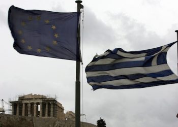 epa03094561 A Greek (R) and European flag (L) flutter in front of the Parthenon of the Acropolis in Athens, Greece, on 06 February 2012. Greek Prime Minister Lucas Papademos was to resume talks with his coalition partners on 06 February in an effort to reach agreement on a new multi-billion euro bailout deal with international lenders. Greece's two largest private and public sector unions called for a 24-hour, nationwide strike on 07 February against the tough austerity measures demanded by international lenders.  EPA/SIMELA PANTZARTZI