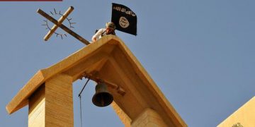 On March 16, 2015, the Islamic State (ISIS) published a collection of images showing an array of acts of vandalism perpetrated against churches in Ninawa, Iraq. The images show ISIS men engaged in the destruction of various Christian symbols, which ISIS perceives as being polytheistic and idolatrous. The men remove crosses from atop churches and replace them with the black ISIS banner, destroy crosses at other locations such as atop doorways and gravestones, and destroy and remove icons and statues inside and outside churches. Ansa/MEMRI's Jihad and Terrorism Threat Monitor (JTTM) ++ No sales, editorial use only ++