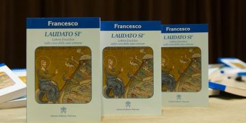 The handout picture provided by L'Osservatore Romano on 18 June 2015 shows some copies of Pope Francis's encyclical, a collection of principles to guide Catholic teaching, entitled "Laudato Si", lying on a table during its official presentation at the Sinod hall in the Vatican, 18 June 2015. ANSA/ L'OSSERVATORE ROMANO   +++ ANSA PROVIDES ACCESS TO THIS HANDOUT PHOTO TO BE USED SOLELY TO ILLUSTRATE NEWS REPORTING OR COMMENTARY ON THE FACTS OR EVENTS DEPICTED IN THIS IMAGE; NO ARCHIVING; NO LICENSING +++