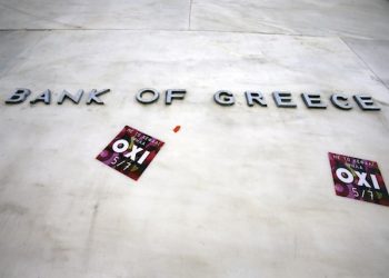 Stickers are seen under the Bank of Greece logo with the word ''NO'' referring to the upcoming referendum in Athens, Thursday, July 2, 2015. The battle for Greek votes entered full swing Thursday ahead of a crucial weekend referendum that could decide whether the country falls out of the euro. (AP Photo/Thanassis Stavrakis)