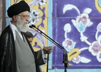 In this picture released by an official website of the office of the Iranian supreme leader on Saturday, July 18, 2015, Supreme Leader Ayatollah Ali Khamenei delivers his sermon during the Eid al-Fitr prayer at the Imam Khomeini Grand Mosque in Tehran, Iran. Khamenei said a historic nuclear deal with world powers reached this week won't change Iran's policy towards the "arrogant" government of the United States. (Office of the Iranian Supreme Leader via AP)