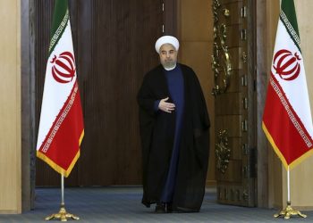 Iran's President Hassan Rouhani arrives for an address to the nation after a nuclear agreement was announced in Vienna, in Tehran, Iran, Tuesday, July 14, 2015. Rouhani said "a new chapter" has begun in his nation's relations with the world. He maintained that Iran had never sought to build a bomb, an assertion the U.S. and its partners have long disputed. (AP Photo/Ebrahim Noroozi)