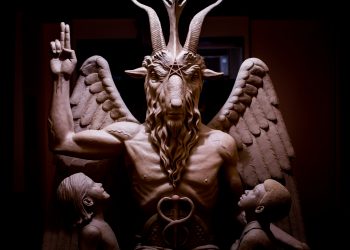 This 2014 photo provided by The Satanic Temple shows a bronze Baphomet, which depicts Satan as a goat-headed figure surrounded by two children. The Satanic Temple, a group advocating the separation of church and state, is considering proposing that the statue be placed outside the Arkansas Statehouse after their first choice of the Oklahoma Capitol grounds was scuttled in 2015 by a state Supreme Court ruling barring all religious monuments. (The Satanic Temple via AP)