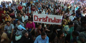 epa04611465 Indian Christians hold a placard and shout  slogans as they   condemn the recent attack on a New Delhi church in Mumbai, India 09 February 2015. Hundreds of Christian participated in the protest. Christians make up 2 percent of India's 1.2 billion population, while 80 per cent are Hindus.  EPA/DIVYAKANT SOLANKI