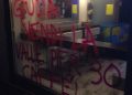 Scritte No Tav a Chiomonte, in Valle di Susa. ''Giuda vendi la valle per 30 caffe''', uno degli slogan scritti sui muri di case ed esercizi commerciali, Chiomonte, Torino, 22 ottobre 2015, ANSA/ DAVIDE PETRIZZELLI
