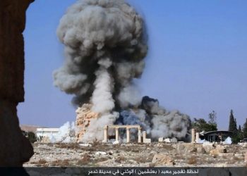FILE - This undated photo released Tuesday, Aug. 25, 2015, file photo, on a social media site used by Islamic State militants, which has been verified and is consistent with other AP reporting, shows smoke from the detonation of the 2,000-year-old temple of Baalshamin in Syria's ancient caravan city of Palmyra. When world leaders convene for the U.N. General Assembly debate Monday, Sept. 28, 2015, it will be a year since the U.S. president declared the formation of an international coalition to "degrade and ultimately destroy" the Islamic State group. Despite billions of dollars spent and thousands of airstrikes, the campaign appears to have made little impact. (Islamic State social media account via AP, File)
