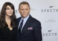epa05002670 Cast members, British actor Daniel Craig (R) and Italian actress Monica Bellucci pose during the photocall of 'Spectre' at the Grand Rex cinema in Paris, France, 29 October 2015. The movie will be released in French theaters on 11 November.  EPA/IAN LANGSDON