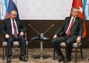 FILE - In this file photo taken on Monday, Nov.  16, 2015, Russian President Vladimir Putin, left, and Turkish President Recep Tayyip Erdogan pose for the media before their talks during the G-20 Summit in Antalya, Turkey.  Putin ordered the deployment of long-range air defense missiles to a Russian military base in Syria and Russiaës military said it would destroy any target that may threaten its warplanes following the downing of a Russian military jet by Turkey. (AP Photo/Alexander Zemlianichenko, file)