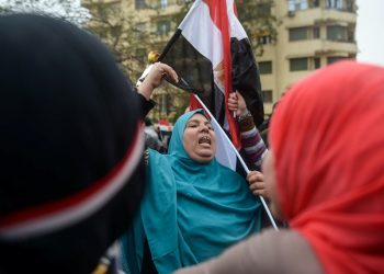 A small number of supporters of Egyptian President Abdel Fattah el-Sissi wave posters and national flags as they mark Police Day, which falls on Jan. 25, the anniversary of the 2011 uprising, in Tahrir Square, Cairo, Egypt, Monday, Jan. 25, 2016. Egypt on Monday marked the fifth anniversary of the popular uprising that toppled longtime autocrat Hosni Mubarak but failed to bring the country the democracy and freedom the young, pro-democracy youths who fueled it had dreamt of. (AP Photo)