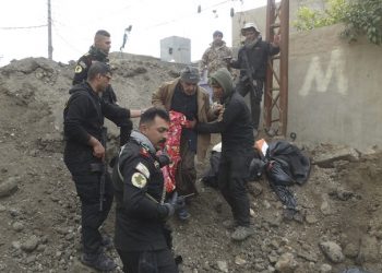 Iraqi security forces and allied Sunni tribal fighters help trapped civilians to cross from neighborhoods under control of Islamic State group to neighborhoods under control of Iraqi security forces in Ramadi, 70 miles (115 kilometers) west of Baghdad, Iraq, Monday, Jan. 4, 2016. Islamic State had captured Ramadi in May, in one of its biggest advances since the U.S.-led coalition began striking the group in 2014. Recapturing the city, which is the provincial capital of Anbar, provided a major morale boost for Iraqi forces. (AP Photo)