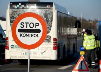 Members of the Danish police have set up a border checkpoint at Krusa border crossing near Flensburg, Germany,  Tuesday Jan. 5, 2016. Denmark introduced temporary controls along its border with Germany.   (Carsten Rehder/dpa via AP)