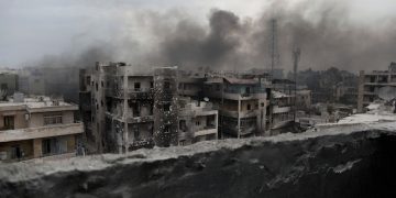 FILE - In this Tuesday, Oct. 2, 2012 file photo, smoke rises over Saif Al Dawla district, in Aleppo, Syria. Aleppo was one of the last cities in Syria to join the uprising against President Bashar Assadís government which began in 2011. (AP Photo/Manu Brabo, File)
