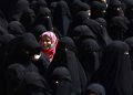 epaselect epa04963330 A Yemeni girl stands among burqa clad women during a rally protesting against Saudi-led coalition airstrikes outside the UN offices in Sanaa, Yemen, 04 October 2015. According to reports, the United Nations Children's Fund (UNICEF) has underscored the devastating toll six months of violence and Saudi-led coalition airstrikes has taken on the children of Yemen, where at least 500 have lost their lives.  EPA/YAHYA ARHAB