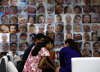 epa04360815 A foreign family talks to a Thai advisor at a fertility clinic where they offer vitro fertilization (IVF) in Bangkok, Thailand, 20 August 2014. Thailand has re-examined its surrogacy laws following the scandal of a surrogate baby affected with Down syndrome being rejected by an Australian couple, which took his twin sister only, and the case of a 24-year-old Japanese man who is suspected of fathering at least nine surrogate babies. Authorities have been examining surrogacy clinics and practices around the country, but complain that legal loopholes make cases difficult to investigate.  EPA/RUNGROJ YONGRIT