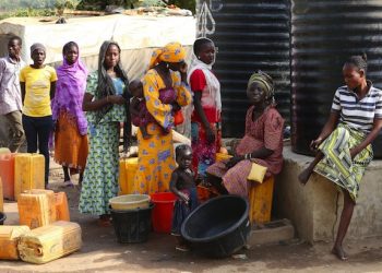 epa05153469 Women gather during the visit of German President Joachim Gauck (not pictured), at New Kichigoro camp for Internally Displaced People, outside Abuja, Nigeria, 10 February 2016. Gauck is on a five-day visit to Nigeria.  EPA/WOLFGANG KUMM