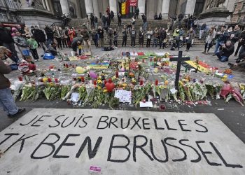 A banner for the victims of the bombings reads " I am Brussels" at the Place de la Bourse in the center of Brussels, Wednesday, March 23, 2016. Bombs exploded yesterday at the Brussels airport and one of the city's metro stations Tuesday, killing and wounding scores of people, as a European capital was again locked down amid heightened security threats. (AP Photo/Martin Meissner)