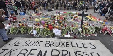 A banner for the victims of the bombings reads " I am Brussels" at the Place de la Bourse in the center of Brussels, Wednesday, March 23, 2016. Bombs exploded yesterday at the Brussels airport and one of the city's metro stations Tuesday, killing and wounding scores of people, as a European capital was again locked down amid heightened security threats. (AP Photo/Martin Meissner)