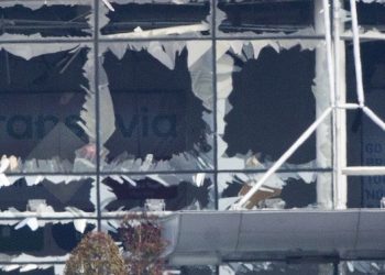 The blown out facade of the terminal is seen at Zaventem airport, one of the sites of two deadly attacks in Brussels, Belgium, Tuesday, March 22, 2016. Authorities in Europe have tightened security at airports, on subways, at the borders and on city streets after the attacks Tuesday on the Brussels airport and its subway system. (AP Photo/Peter Dejong)