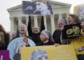 Nuns with the Little Sisters of The Poor, including Sister Celestine, left, and Sister Jeanne Veronique, center, rally outside the Supreme Court in Washington, Wednesday, March 23, 2016, as the court hears arguments to allow birth control in healthcare plans in the Zubik vs. Burwell case. (AP Photo/Jacquelyn Martin)
