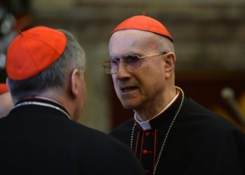 Cardinal Tarcisio Bertone during the traditional Greetings of Pope Francis to the Roman Curia on December 21, 2015 at the Vatican. ANSA / POOL - AFP PHOTO / ALBERTO PIZZOLI