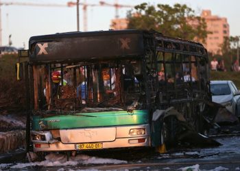 A burned bus is seen in Jerusalem, Monday, April 18, 2016. A bus exploded in the heart of Jerusalem Monday, wounding at least 15 people who appeared to have been in an adjacent bus that was also damaged. The explosion raised fears of a return to the Palestinian suicide attacks that ravaged Israeli cities a decade ago. (AP Photo/Oded Balilty)