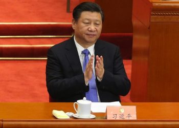 epa05210514 Chinese President Xi Jinping claps during the closing of the Fourth Session of the 12th National Committee of the Chinese People's Political Consultative Conference (CPPCC) at the Great Hall of the People (GHOP) in Beijing, China, 14 March 2016. The CPPCC is the top advisory body of the Chinese political system and runs alongside the annual plenary meetings of the 12th National People's Congress (NPC), together known as 'Lianghui' or 'Two Meetings'.  EPA/WU HONG