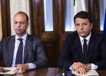 Italian Prime Minister Matteo Renzi, right, while presiding the meeting of the national pubblic safety committee summoned by Italian Interior Minister Angelino Alfano, left, after the terror attacks today in Brussels. Rome, March 22, 2016. ANSA/ ANGELO CARCONI