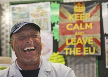 Fishmonger Dave Crosbie speaks to the Associated Press at the market in Havering's  Romford  street market in London, Wednesday, June 1, 2016. When Britain decides on Thursday June 23, 20916, whether to leave the European Union, London's voice may prove decisive. But for which side? Britain's capital, home to almost 9 million people, encompasses the most pro-EU place of the country, and the least. In the cosmopolitan City financial district, where almost half a million people from around the globe work in Europe's biggest financial center, pro-EU sentiment predominates. But just a few miles away, the borough of Havering, stronghold of working-class East Enders, topped a national survey of the most anti-EU places in Britain. (AP Photo/Frank Augstein)