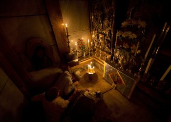 Christians pray jesus' tomb in side as team of experts begin renovation of Jesus' tomb in Jerusalem's Church of the Holy Sepulchre in Jerusalem's old city, Monday, June 6, 2016. A team of experts has begun a historic renovation at the spot where Christians believe Jesus was buried, overcoming longstanding religious rivalries to carry out the first repairs at the site in over 200 years. (AP Photo/Ariel Schalit)