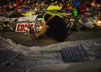 epa05365837 Jean Dasilva, who lost his friend Javier George-Reyes in a mass shooting, cries next to the memorial site outside of the Dr. Phillips Center for the Performing Arts in Downtown, Orlando, Florida, USA, 14 June 2016. A total of 50 people, including the suspect gunman, were killed and 53 were injured in a mass shooting attack at an LGBT club in Orlando, Florida, in the early hours of 12 June. The shooter was killed in an exchange of fire with the police after taking hostages at the club.  EPA/JOHN TAGGART