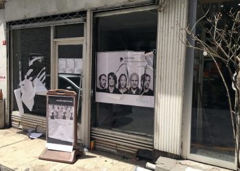 A ripped up poster advertising the streaming event of Radiohead's new album, at a record shop, in Istanbul, Saturday, June 18, 2016. Turkish media report a mob of 20 assailants carrying sticks and bottles attacked Radiohead fans who had gathered at a record store in Istanbul to listen to the band's new album. The private Dogan news agency reported Saturday that one person was wounded in the incident Friday at the Velvet Indieground record shop. (AP Photo/Dominique Soguel)
