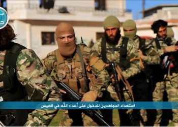 FILE - This file photo posted on the Twitter page of Syria's al-Qaida-linked Nusra Front on April 1, 2016, shows fighters from al-Qaida's branch in Syria, the Nusra Front, marching toward the northern village of al-Ais in Aleppo province, Syria. The leader of Syria‚Äôs Nusra Front said Thursday, July 28, 2016 that his group is changing name, and claims it will have no more ties with al-Qaida. (Al-Nusra Front via AP, File)