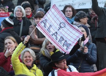Participants of a women's  flash mob  demonstrate against racism and sexism    in Cologne, Germany, Saturday, Jan.  9, 2016.  Women’s rights activists, far-right demonstrators and left-wing counter-protesters all took to the streets of Cologne on Saturday in the aftermath of a string of New Year’s Eve sexual assaults and robberies in Cologne blamed largely on foreigners.  (AP Photo/Juergen Schwarz)