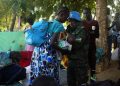 epa05426413 A handout photograph released on 15 July 2016 by the United Nations Mission in South Sudan (UNMISS) shows UN personnel handing a baby to its mother, The Tomping base of the UNMISS, Juba, South Sudan, 14 July 2016. Media reported that South Sudan's president on 11 July called for an immediate ceasefire to end fighting between the country's two warring factions, after days of renewed clashes in Juba, South Sudan's capital that killed over 269 people since 07 July.  EPA/BEATRICE MATEGWA / UNMISS / HAND  HANDOUT EDITORIAL USE ONLY/NO SALES