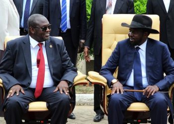 epa05282893 South Sudan President Salva Kiir (R) and former rebel leader and First Vice-President Riek Machar (L) attend a ceremony after a new unity government was sworn-in, Juba, South Sudan, 29 April 2016. South Sudan President Salva Kiir named a new unity government sharing power with former rebel leader Riek Machar, ending a conflict that erupted since mid-December 2013. According to peace agreement, the interim government will govern for the next 30 months before holding general elections.  EPA/PHILLIP DHIL