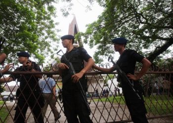 Indonesian police officers guard in front of a church where a suicide bomber failed to detonate explosives during the Sunday Mass in Medan, North Sumatra, Indonesia, Sunday, Aug. 28, 2016. Police in western Indonesia say a would-be suicide bomber failed to detonate explosives in a packed church during Sunday Mass.(AP Photo/Binsar Bakkara)