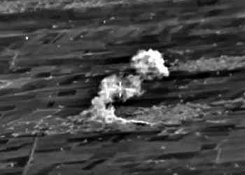 epa04972146 A handout frame grab taken from a video footage made available on the official website of the Russian Defence Ministry on 10 October 2015 shows an aerial view of  bomb explosions at the site fortified positions in the Aleppo province, what Russia says was an Islamic State (ISIS or IS) terrorist ammunition depot after a strike carried out by Russian warplanes in Syrian territories.  EPA/RUSSIAN DEFENCE MINISTRY PRESS SERVICE/HANDOUT BEST QUALITY AVAILABLE HANDOUT EDITORIAL USE ONLY/NO SALES