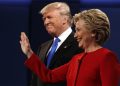 Republican presidential candidate Donald Trump, left, stands with Democratic presidential candidate Hillary Clinton at the first presidential debate at Hofstra University, Monday, Sept. 26, 2016, in Hempstead, N.Y. (ANSA/AP Photo/ Evan Vucci) [CopyrightNotice: Copyright 2016 The Associated Press. All rights reserved.]