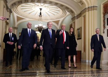 Vice president-elect Mike Pence, second from  left, Senate Majority Leader Mitch McConnell, of Kentucky, President-elect Donald Trump, giving a thumbs up, and Milania Trump walk to a meeting on Capitol Hill, Thursday, Nov. 10, 2016 in Washington. (AP Photo/Alex Brandon)