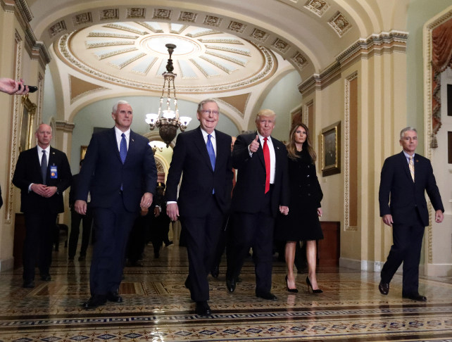 Vice president-elect Mike Pence, second from  left, Senate Majority Leader Mitch McConnell, of Kentucky, President-elect Donald Trump, giving a thumbs up, and Milania Trump walk to a meeting on Capitol Hill, Thursday, Nov. 10, 2016 in Washington. (AP Photo/Alex Brandon)