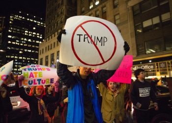 epa05629129 Protesters take to the streets following an anti-Trump demonstration in front of Trump Tower in Manhattan, New York, New York, USA, 12 November 2016. President-elect Donald Trump will become the 45th President of the United States of America to serve from 2017 through 2020.  EPA/KEVIN HAGEN