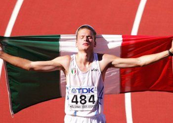 Italian Alex Schwarzer celebrates placing third in the 50km Walk at the 10th IAAF World Championships in Athletics, Helsinki, Finland, Friday 12 August 2005.
ANSA/FABRICE COFFRINI