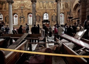 Security forces examine the scene inside the St. Mark Cathedral in central Cairo, following a bombing, Sunday, Dec. 11, 2016. The blast at Egypt's main Coptic Christian cathedral killed dozens of people and wounded many others on Sunday, according to Egyptian state television, making it one of the deadliest attacks carried out against the religious minority in recent memory. (ANSA/AP Photo/Nariman El-Mofty) [CopyrightNotice: Copyright 2016 The Associated Press. All rights reserved.]