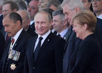 epa04242605 (L-R) Governor-General of New Zealand Jerry Mateparae, Russian President Vladamir Putin, Czech President Milos Zeman, German Chancellor Angela Merkel, and world leaders at Sword Beach during a service of remembrance in Ouistreham, Normandy, France, 06 June, 2014. World leaders are gathering in Normandy 06 June to commemorate the 70th anniversary of the D-Day landings. More than 75,000 British Canadian and other Commonwealth Troops landed on the beaches of Normandy on 06 June 1944 alongside the United States and the Free French, in an Allied invasion of more than 130,000. Another 7,900 British troops were landed by Air.The invasion established a crucial second front in the Liberation of Europe from Nazi occupation, ultimately leading to victory for Allied Forces in 1945.  EPA/ANDY RAIN  EPA/ANDY RAIN