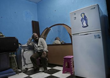 Egyptian Christian Ezzat Yaacoub Ishak who fled el-Arish due to fighting sits in his newly rented apartment, in Ismailia, 120 kilometers (75 miles) east of Cairo, Egypt, Sunday, Feb. 26, 2017. Ishak and his family fled two days ago. Egyptian Christians fearing attacks by Islamic State militants are fleeing the volatile northern part of the Sinai Peninsula for a fourth day, after a string of sectarian killings there sent hundreds fleeing and raised accusations the government is failing to protect the minority. (AP Photo/Nariman El-Mofty)